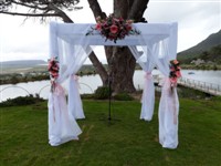 Draped bridal canopy decorated with flowers